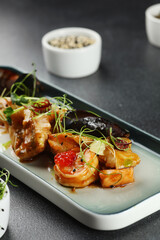 seafood plate with mussels and shrimp toped microgreen closeup