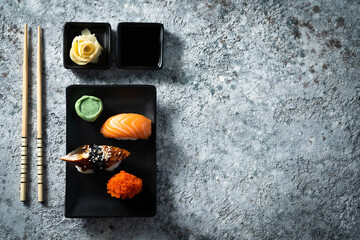 Selection of sushi on rustic background, copy space