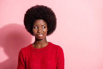Photo of disgusted unhappy afro american young woman look empty space dislike isolated on pink...