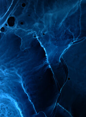 Abstract blue electric wave on black technology background. Neon light paint in water, acrylic...