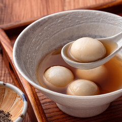 Sesame big tangyuan with syrup soup.