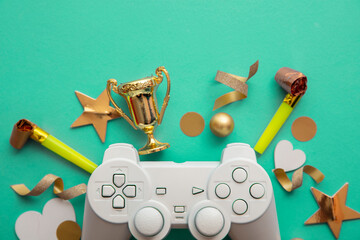 Video game esports winning competition background. Game controller with gold winning trophy
