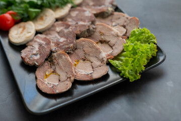 slicing pork and beef meat on a plate