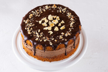 Chocolate pumpkin pie with orange on a light background. Sugar, gluten and lactose free and vegan.