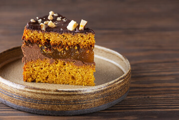 Piece of American pumpkin pie on a plate. Horizontal orientation, copy space.