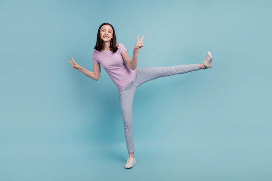 Full length photo of excited girl have fun fooling show peace cool v-sign isolated over teal color background