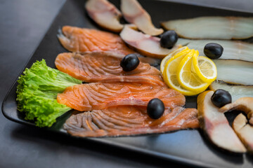 assorted appetizer pieces of fish on a plate