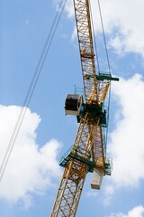 Naklejka premium Construction site, workers and cranes.