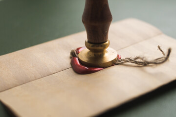 Sealing wax in a candle, a bar. Envelope with wax seal