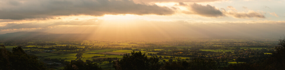 Malvern Hills view facing east on an autumn morning. Dramatic dawn panorama
