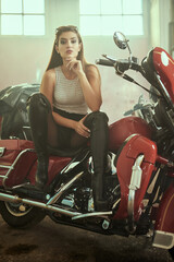 Obraz na płótnie Canvas beautiful girl on a motorbike
