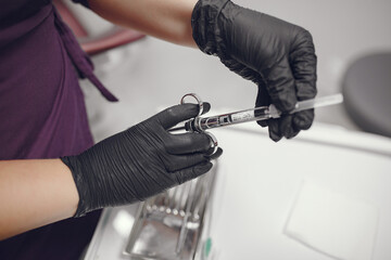 Dental tools in a dentist hand