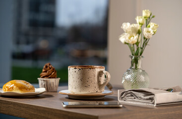 Breakfast in the morning with a cup of coffee on the table