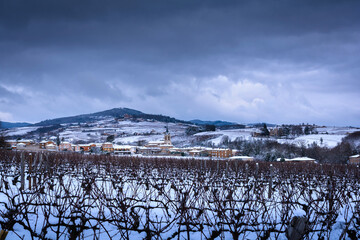 Village of Denice and landscape of Beaujolais under the snow