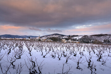 Village of Denice and landscape of Beaujolais under the snow