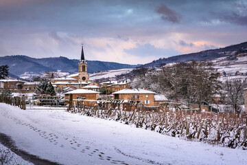 Village of Denice and landscape of Beaujolais under the snow