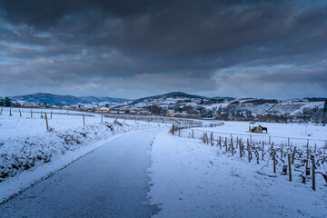 Village of Denice and landscape of Beaujolais under the snow