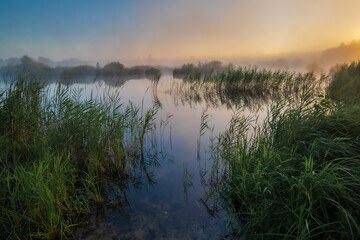 Fototapeta premium morning mist over the lake