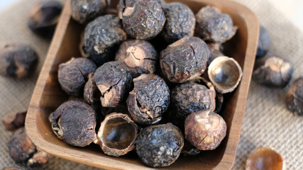 heap of soap nut for ecological washing. Raw Aritha or Reetha fruit also known as Soap-nuts which is the main ingredient in any soaps and shampoos.