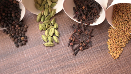 Collection of indian Spices and herbs. Food and cuisine ingredients on wooden background.