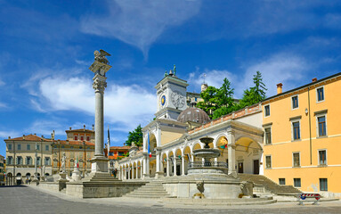 Udine, Square Liberty (La Piazza Liberta) and the clock tower and a column topped by the Lion of Saint Mark. Italy