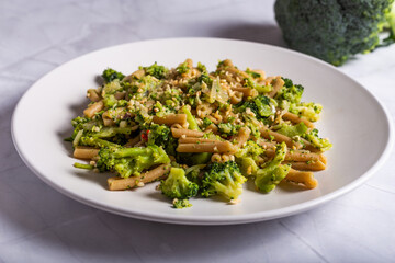 Vegan wholemeal pasta with broccoli and chopped hazelnuts.CR2