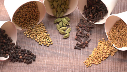 Collection of indian Spices and herbs. Food and cuisine ingredients on wooden background.