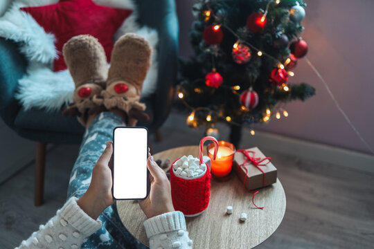 Mock up phone with place for your text on a cozy christmas background