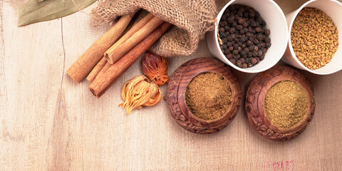 Collection of indian Spices and herbs. Food and cuisine ingredients on wooden background.