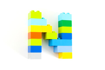 Colorful toy brick letter N