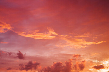 Red-orange sky with clouds before sunrise. Beautiful August landscape with sunrise sky