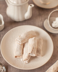 Fototapeta na wymiar Vanilla crescent rolls dusted with icing sugar