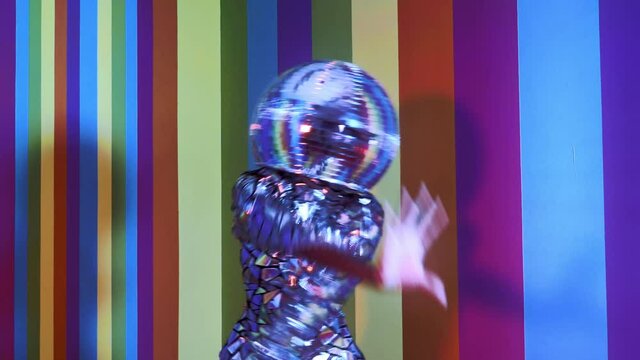 Cinematic footage of a woman dancing inside a box room