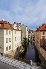 Fototapeta na wymiar the Certovka canal and houses on the waterfront in downtown Prague