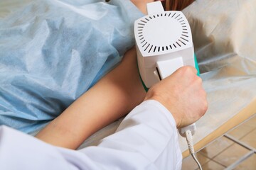 A woman is given a healing massage