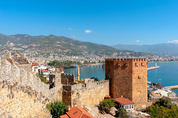 View of the resort town of Alanya, the Red Tower on the shores of the Mediterranean Sea.