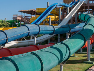 Beautiful view of a water park with colorful slides on a sunny day.