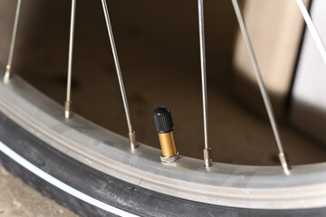 Schrader valve bicycle and bicycle wheel with spokes.