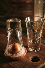 Shots of tequila with slices of lime and salt