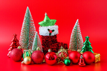 Christmas tree and baubles on red background new year  holiday celebration concept