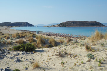 Beautiful sandy beach of Simos with crystal clear turquoise sea and natural sand dunes, Elafonisos island, Peloponnese, Greece