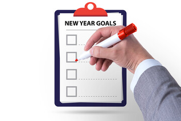 Businessman writing his new year resolution