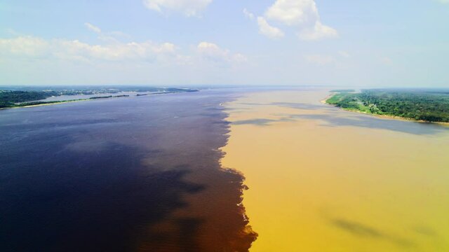 The confluence of two rivers in the Amazon. Manaus, Rio Negro.