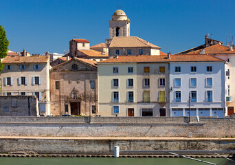 Obraz premium Arles. City embankment and facades of old houses.