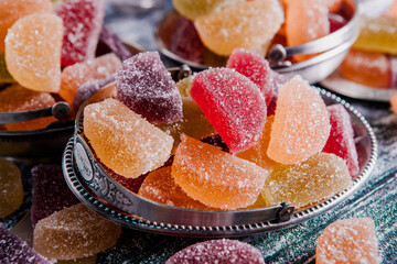 Dessert marmalade in the form of lemon and orange slices. The sweetness of jelly candy.