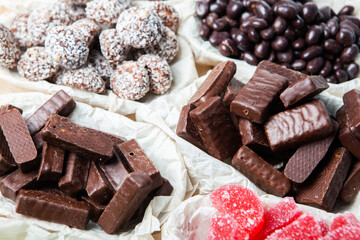Assortment of delicious chocolate candies background. Chocolate candy isolated 