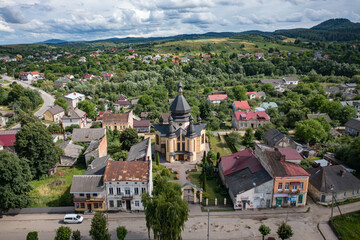 Fototapeta na wymiar Aerial view on Church of St. Andrew the First-Called in Dobromyl, Ukraine from drone