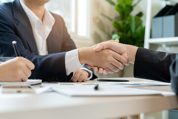 Congrats, business partnership people, asian happy young man, woman handshake, shaking hands together with partnership, customer or colleague after is done, successful. Worker meeting.