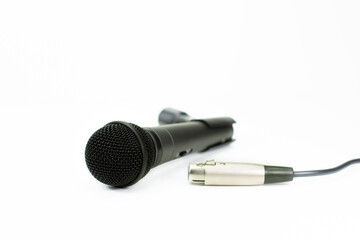 microphone and cable isolated on white table