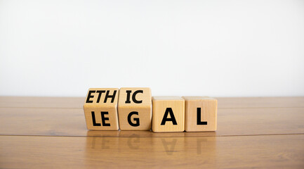 Ethical or legal symbol. Turned wooden cubes and changed the word 'legal' to 'ethical' on a...